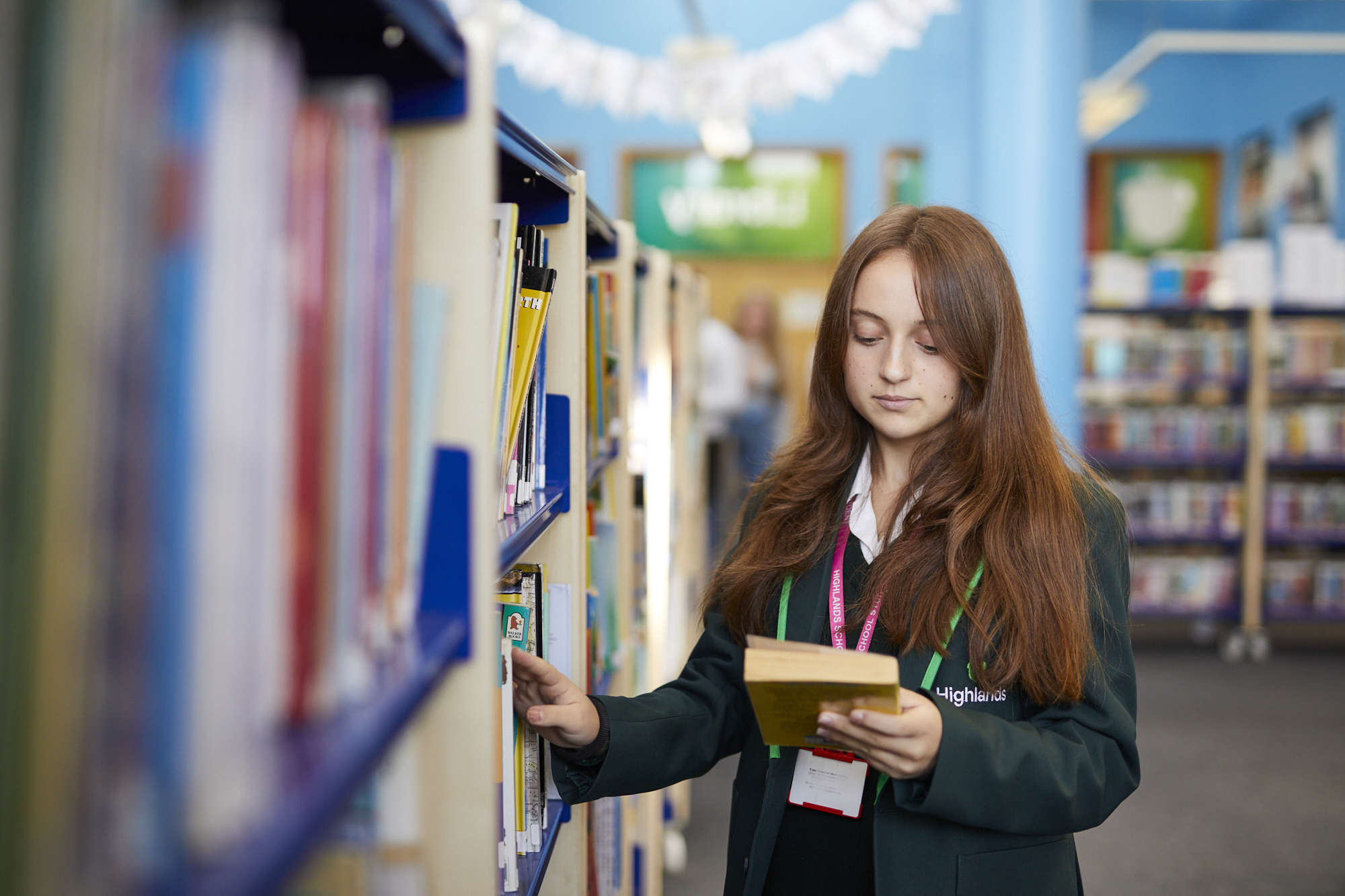 student in library
